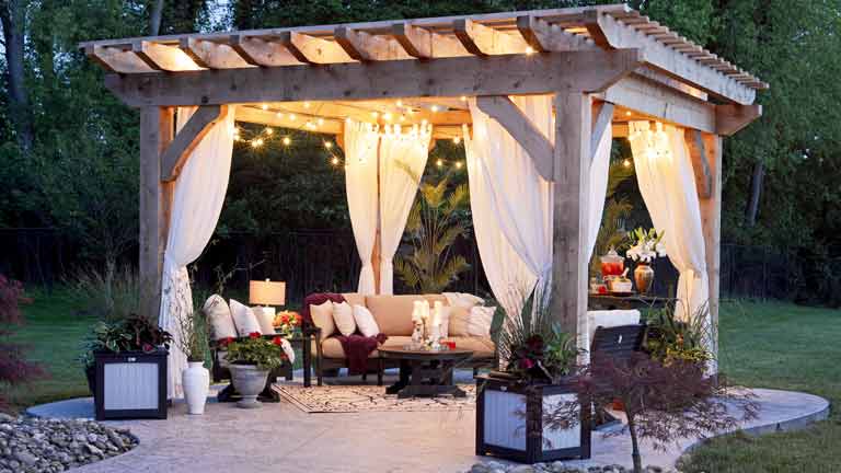 Bespoke garden pergola construction and decorative trellis installation