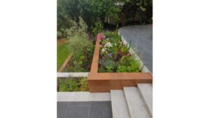 Hard landscaping project with paved patio and retaining walls