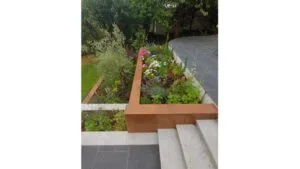Hard landscaping project with paved patio and retaining walls