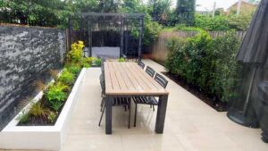 Hard landscaping project with paved patio and retaining walls